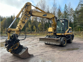 Pyöräalustainen kaivinkone Caterpillar M312 Engcon EC20 tiltrotator