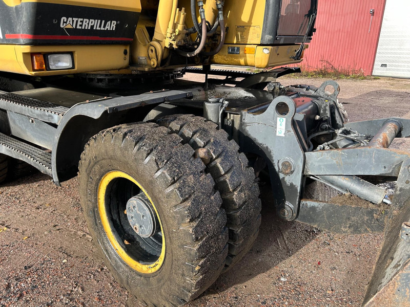 Pyöräalustainen kaivinkone Caterpillar M312 Engcon EC20 tiltrotator