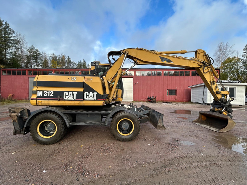 Pyöräalustainen kaivinkone Caterpillar M312 Engcon EC20 tiltrotator