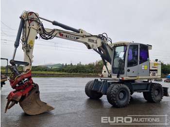 Pyöräalustainen kaivinkone TEREX
