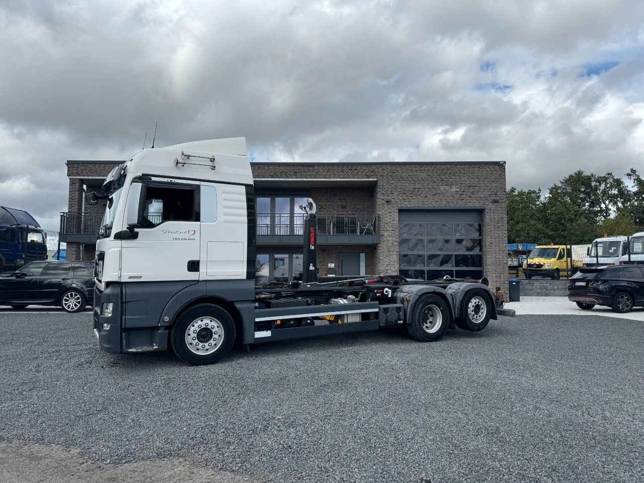 MAN TGX 26.520 D38 Abrollkipper Multilift - Koukkulava kuorma-auto: kuva MAN TGX 26.520 D38 Abrollkipper Multilift - Koukkulava kuorma-auto MAN TGX 26.520 D38 Abrollkipper Multilift - Koukkulava kuorma-auto: kuva MAN TGX 26.520 D38 Abrollkipper Multilift - Koukkulava kuorma-auto