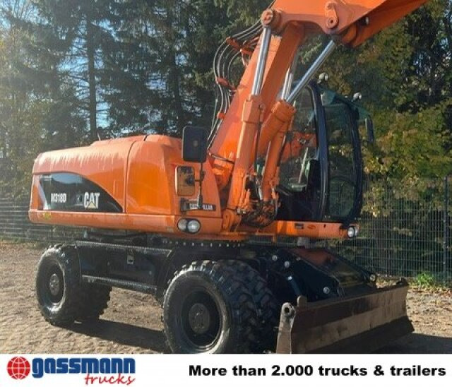 CAT M318D Mobilbagger - Pyöräalustainen kaivinkone: kuva CAT M318D Mobilbagger - Pyöräalustainen kaivinkone CAT M318D Mobilbagger - Pyöräalustainen kaivinkone: kuva CAT M318D Mobilbagger - Pyöräalustainen kaivinkone