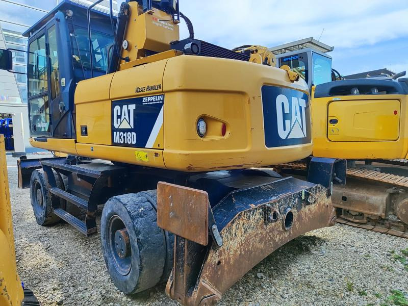 Caterpillar M318D MH - Pyöräalustainen kaivinkone: kuva Caterpillar M318D MH - Pyöräalustainen kaivinkone Caterpillar M318D MH - Pyöräalustainen kaivinkone: kuva Caterpillar M318D MH - Pyöräalustainen kaivinkone