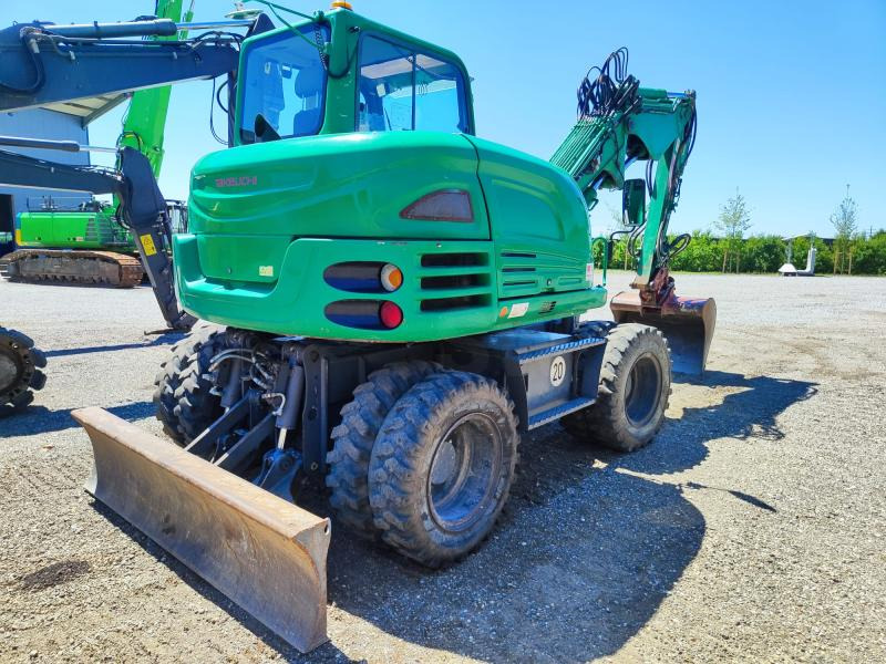 Takeuchi TB295W - Pyöräalustainen kaivinkone: kuva Takeuchi TB295W - Pyöräalustainen kaivinkone Takeuchi TB295W - Pyöräalustainen kaivinkone: kuva Takeuchi TB295W - Pyöräalustainen kaivinkone