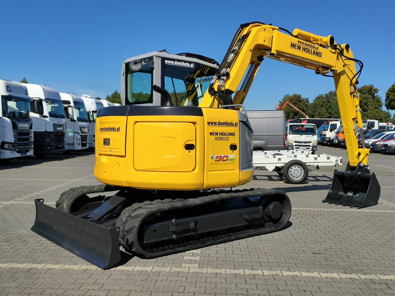 New Holland E90B SR -2 Gąsienicowa 10ton - Minikuormaaja: kuva New Holland E90B SR -2 Gąsienicowa 10ton - Minikuormaaja New Holland E90B SR -2 Gąsienicowa 10ton - Minikuormaaja: kuva New Holland E90B SR -2 Gąsienicowa 10ton - Minikuormaaja