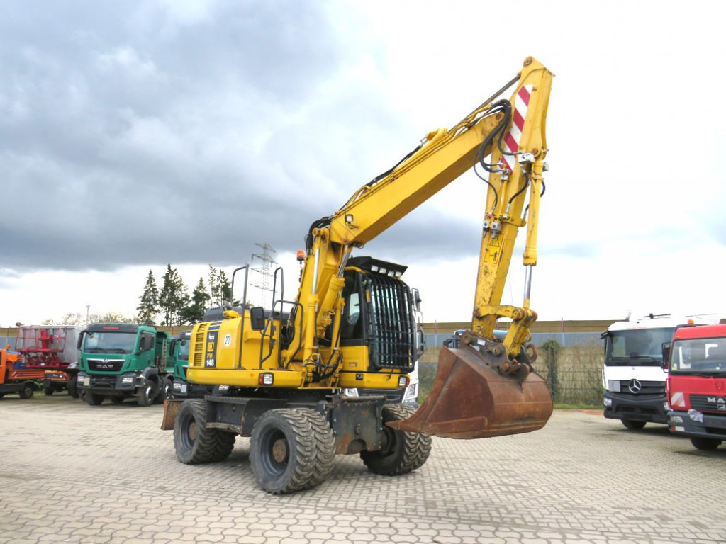 KOMATSU HANOMAG Mobilbagger PW 148 - 8 Bagger 6.824h Deutsch top - Pyöräalustainen kaivinkone: kuva KOMATSU HANOMAG Mobilbagger PW 148 - 8 Bagger 6.824h Deutsch top - Pyöräalustainen kaivinkone KOMATSU HANOMAG Mobilbagger PW 148 - 8 Bagger 6.824h Deutsch top - Pyöräalustainen kaivinkone: kuva KOMATSU HANOMAG Mobilbagger PW 148 - 8 Bagger 6.824h Deutsch top - Pyöräalustainen kaivinkone