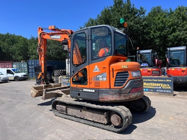 Doosan DX 63-3 - Minikuormaaja: kuva Doosan DX 63-3 - Minikuormaaja Doosan DX 63-3 - Minikuormaaja: kuva Doosan DX 63-3 - Minikuormaaja