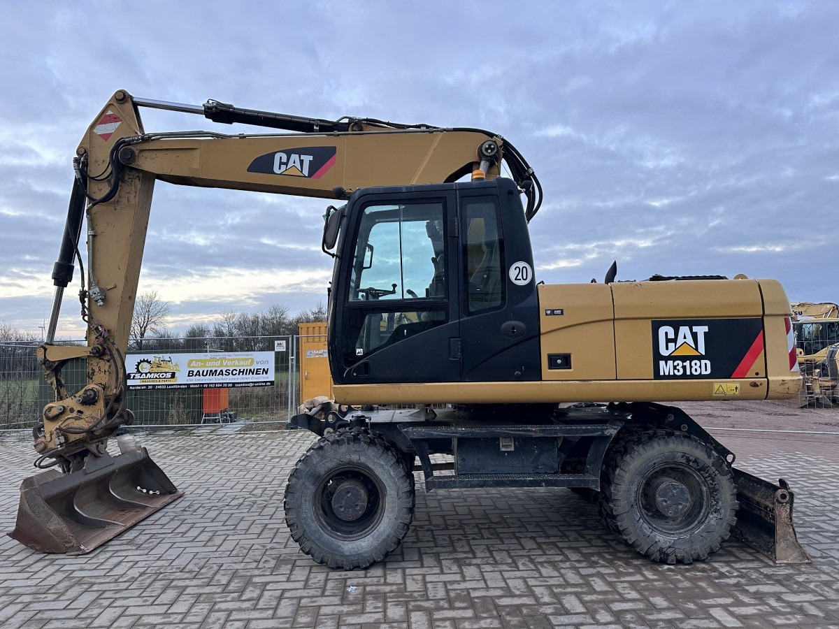CATERPILLAR M 318 D full Hydr. Top Zustand German machine ! - Pyöräalustainen kaivinkone: kuva CATERPILLAR M 318 D full Hydr. Top Zustand German machine ! - Pyöräalustainen kaivinkone CATERPILLAR M 318 D full Hydr. Top Zustand German machine ! - Pyöräalustainen kaivinkone: kuva CATERPILLAR M 318 D full Hydr. Top Zustand German machine ! - Pyöräalustainen kaivinkone