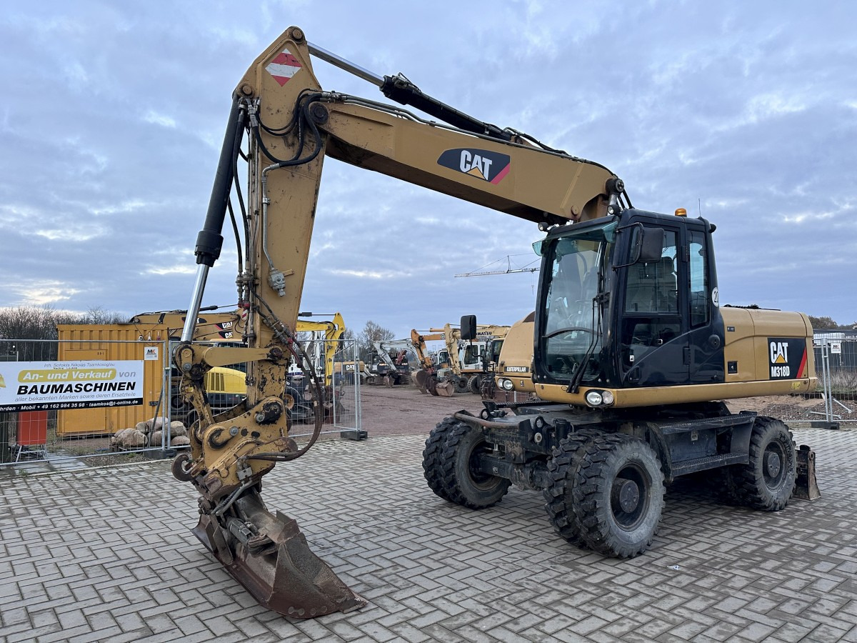 CATERPILLAR M 318 D full Hydr. Top Zustand German machine ! - Pyöräalustainen kaivinkone: kuva CATERPILLAR M 318 D full Hydr. Top Zustand German machine ! - Pyöräalustainen kaivinkone CATERPILLAR M 318 D full Hydr. Top Zustand German machine ! - Pyöräalustainen kaivinkone: kuva CATERPILLAR M 318 D full Hydr. Top Zustand German machine ! - Pyöräalustainen kaivinkone