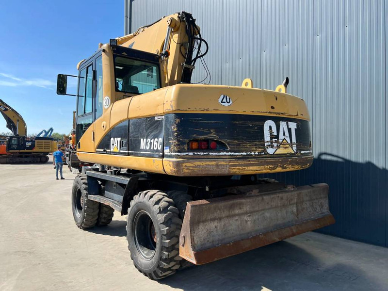 Cat M316C - Pyöräalustainen kaivinkone: kuva Cat M316C - Pyöräalustainen kaivinkone Cat M316C - Pyöräalustainen kaivinkone: kuva Cat M316C - Pyöräalustainen kaivinkone