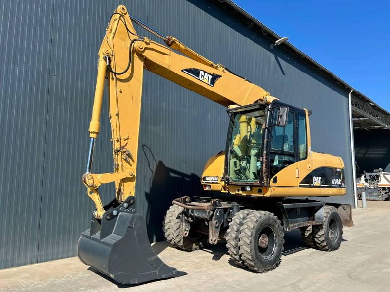 Cat M316C - Pyöräalustainen kaivinkone: kuva Cat M316C - Pyöräalustainen kaivinkone Cat M316C - Pyöräalustainen kaivinkone: kuva Cat M316C - Pyöräalustainen kaivinkone