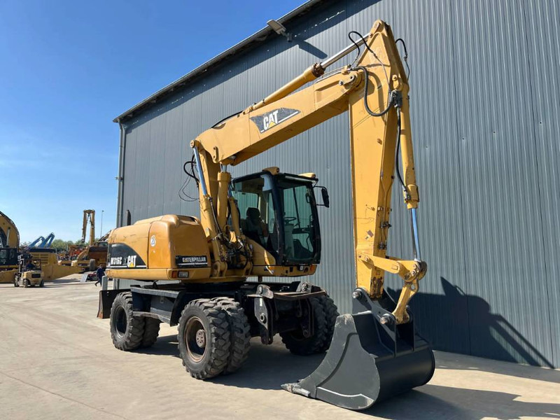 Cat M316C - Pyöräalustainen kaivinkone: kuva Cat M316C - Pyöräalustainen kaivinkone Cat M316C - Pyöräalustainen kaivinkone: kuva Cat M316C - Pyöräalustainen kaivinkone