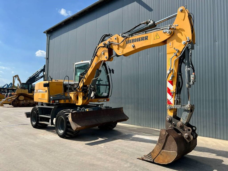 Liebherr A311 Litronic - Pyöräalustainen kaivinkone: kuva Liebherr A311 Litronic - Pyöräalustainen kaivinkone Liebherr A311 Litronic - Pyöräalustainen kaivinkone: kuva Liebherr A311 Litronic - Pyöräalustainen kaivinkone