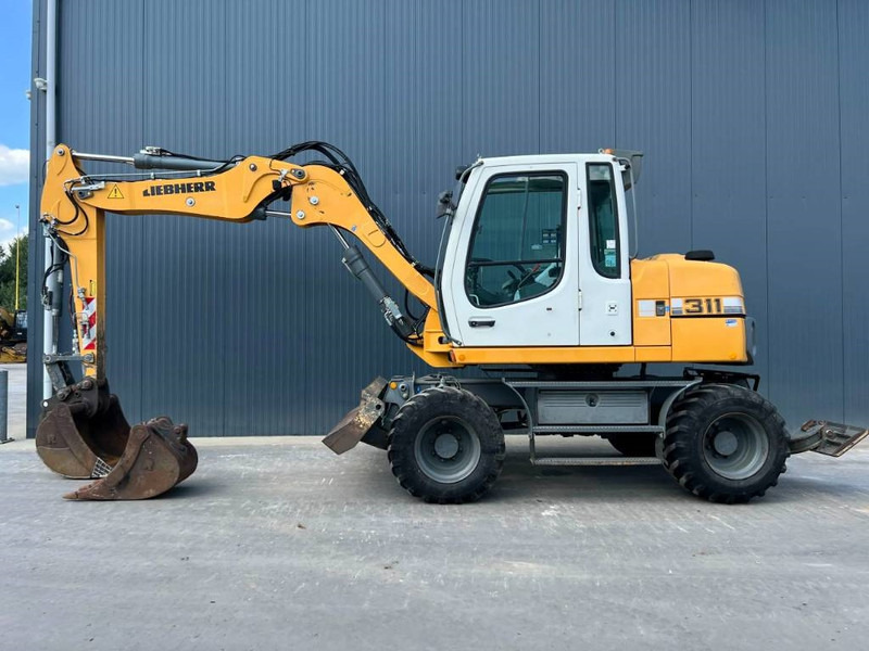 Liebherr A311 Litronic - Pyöräalustainen kaivinkone: kuva Liebherr A311 Litronic - Pyöräalustainen kaivinkone Liebherr A311 Litronic - Pyöräalustainen kaivinkone: kuva Liebherr A311 Litronic - Pyöräalustainen kaivinkone