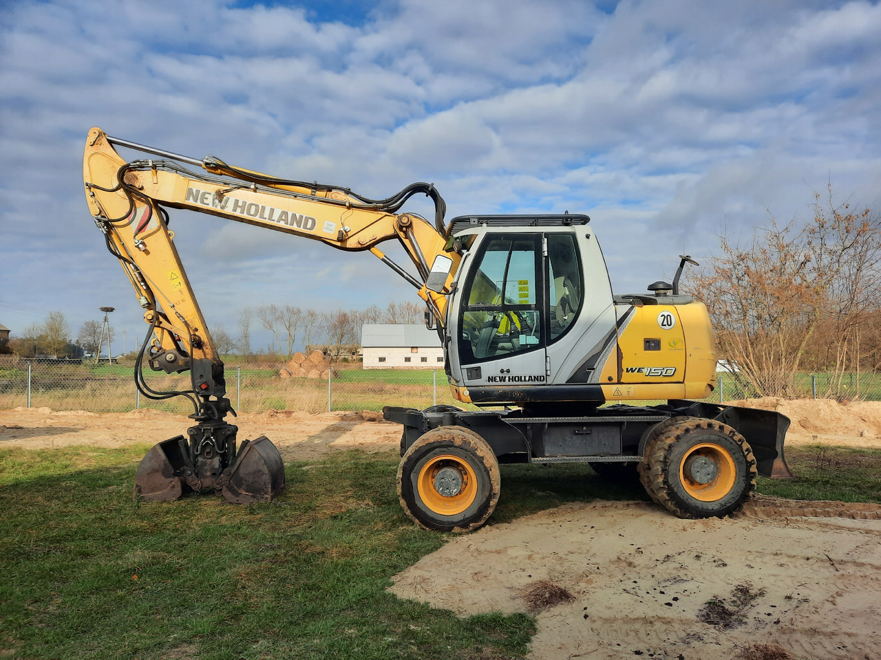 NEW HOLLAND WE150C - Pyöräalustainen kaivinkone: kuva NEW HOLLAND WE150C - Pyöräalustainen kaivinkone NEW HOLLAND WE150C - Pyöräalustainen kaivinkone: kuva NEW HOLLAND WE150C - Pyöräalustainen kaivinkone