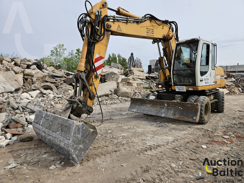 Liebherr A 316 Litronic - Pyöräalustainen kaivinkone: kuva Liebherr A 316 Litronic - Pyöräalustainen kaivinkone Liebherr A 316 Litronic - Pyöräalustainen kaivinkone: kuva Liebherr A 316 Litronic - Pyöräalustainen kaivinkone