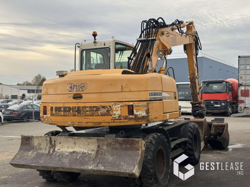 Liebherr A312 Litronic - Pyöräalustainen kaivinkone: kuva Liebherr A312 Litronic - Pyöräalustainen kaivinkone Liebherr A312 Litronic - Pyöräalustainen kaivinkone: kuva Liebherr A312 Litronic - Pyöräalustainen kaivinkone