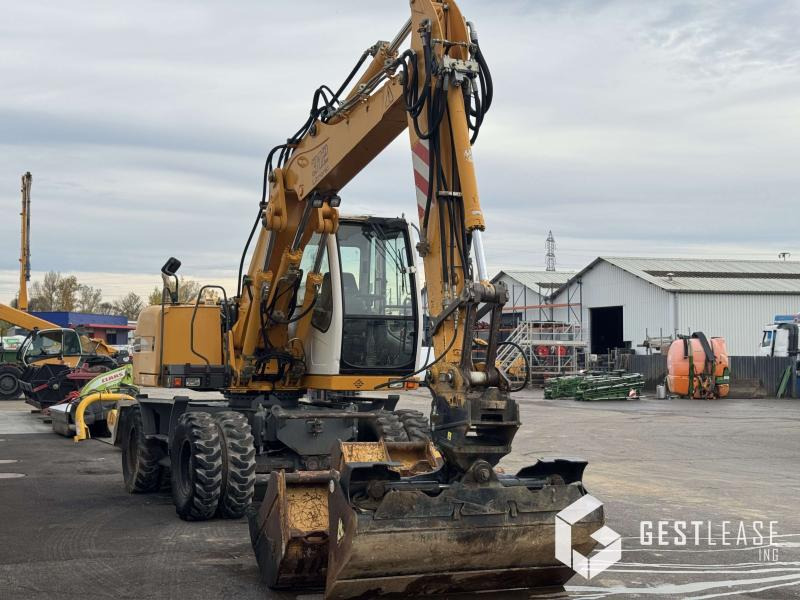 Liebherr A312 Litronic - Pyöräalustainen kaivinkone: kuva Liebherr A312 Litronic - Pyöräalustainen kaivinkone Liebherr A312 Litronic - Pyöräalustainen kaivinkone: kuva Liebherr A312 Litronic - Pyöräalustainen kaivinkone