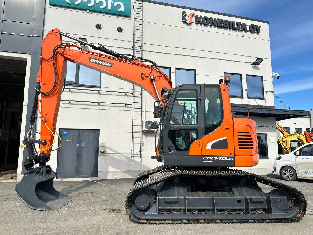 Doosan DX 140 LCR-5 metsäalusta - Telakaivukone: kuva Doosan DX 140 LCR-5 metsäalusta - Telakaivukone Doosan DX 140 LCR-5 metsäalusta - Telakaivukone: kuva Doosan DX 140 LCR-5 metsäalusta - Telakaivukone