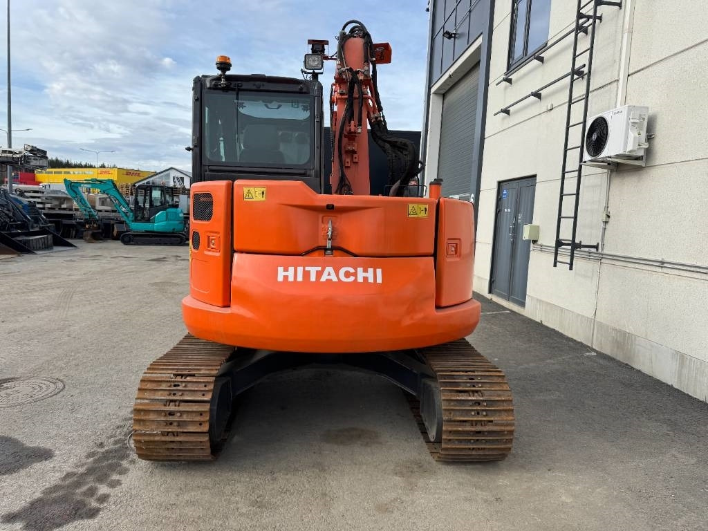 Hitachi ZX 85 US-5 Pyörittäjä, 3-Kauhaa - Minikuormaaja: kuva Hitachi ZX 85 US-5 Pyörittäjä, 3-Kauhaa - Minikuormaaja Hitachi ZX 85 US-5 Pyörittäjä, 3-Kauhaa - Minikuormaaja: kuva Hitachi ZX 85 US-5 Pyörittäjä, 3-Kauhaa - Minikuormaaja