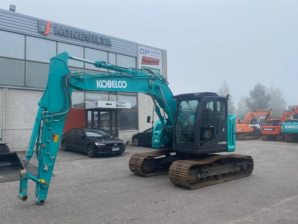 Kobelco SK140SRLC-7 - Telakaivukone: kuva Kobelco SK140SRLC-7 - Telakaivukone Kobelco SK140SRLC-7 - Telakaivukone: kuva Kobelco SK140SRLC-7 - Telakaivukone