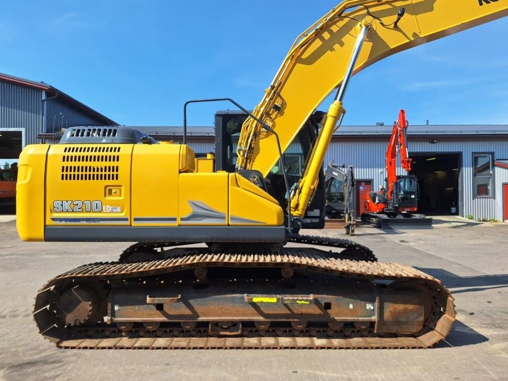 Kobelco SK210LC-11 PYÖRITTÄJÄLLÄ - Telakaivukone: kuva Kobelco SK210LC-11 PYÖRITTÄJÄLLÄ - Telakaivukone Kobelco SK210LC-11 PYÖRITTÄJÄLLÄ - Telakaivukone: kuva Kobelco SK210LC-11 PYÖRITTÄJÄLLÄ - Telakaivukone