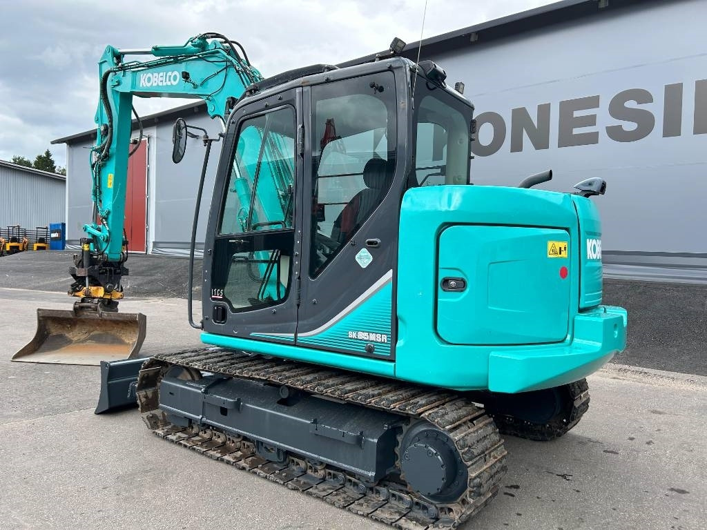Kobelco SK85MSR-3 PYÖRITTÄJÄLLÄ - Minikuormaaja: kuva Kobelco SK85MSR-3 PYÖRITTÄJÄLLÄ - Minikuormaaja Kobelco SK85MSR-3 PYÖRITTÄJÄLLÄ - Minikuormaaja: kuva Kobelco SK85MSR-3 PYÖRITTÄJÄLLÄ - Minikuormaaja