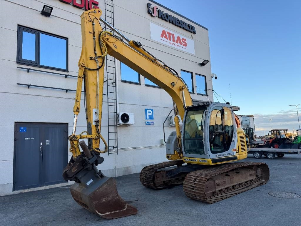 New Holland E 135 SR LC - Telakaivukone: kuva New Holland E 135 SR LC - Telakaivukone New Holland E 135 SR LC - Telakaivukone: kuva New Holland E 135 SR LC - Telakaivukone