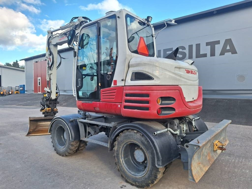 Takeuchi TB295W PYÖRITTÄJÄLLÄ - Pyöräalustainen kaivinkone: kuva Takeuchi TB295W PYÖRITTÄJÄLLÄ - Pyöräalustainen kaivinkone Takeuchi TB295W PYÖRITTÄJÄLLÄ - Pyöräalustainen kaivinkone: kuva Takeuchi TB295W PYÖRITTÄJÄLLÄ - Pyöräalustainen kaivinkone