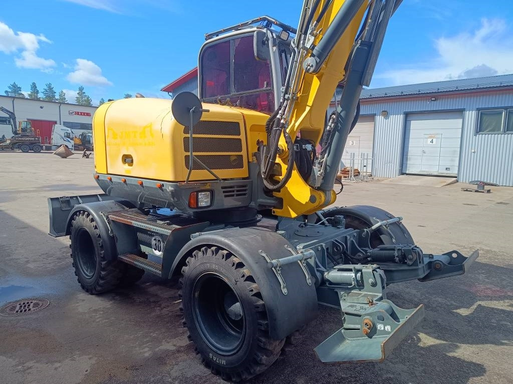 Wacker Neuson EW100 PYÖRITTÄJÄLLÄ - Pyöräalustainen kaivinkone: kuva Wacker Neuson EW100 PYÖRITTÄJÄLLÄ - Pyöräalustainen kaivinkone Wacker Neuson EW100 PYÖRITTÄJÄLLÄ - Pyöräalustainen kaivinkone: kuva Wacker Neuson EW100 PYÖRITTÄJÄLLÄ - Pyöräalustainen kaivinkone