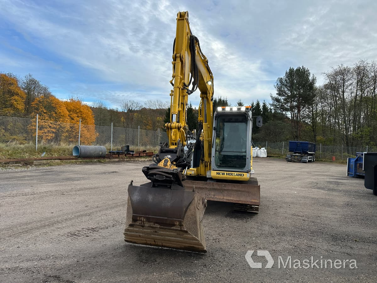 Grävmaskin New Holland Kobelco E70BSR-2 - Telakaivukone: kuva Grävmaskin New Holland Kobelco E70BSR-2 - Telakaivukone Grävmaskin New Holland Kobelco E70BSR-2 - Telakaivukone: kuva Grävmaskin New Holland Kobelco E70BSR-2 - Telakaivukone