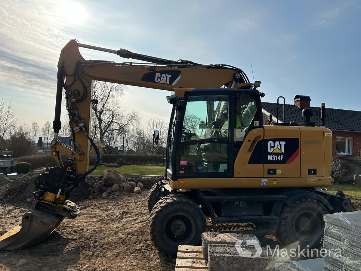 Hjulgrävare Cat M314F + redskap/vagn/grävsystem - Telakaivukone: kuva Hjulgrävare Cat M314F + redskap/vagn/grävsystem - Telakaivukone Hjulgrävare Cat M314F + redskap/vagn/grävsystem - Telakaivukone: kuva Hjulgrävare Cat M314F + redskap/vagn/grävsystem - Telakaivukone