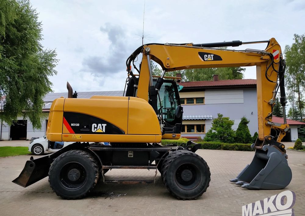 Caterpillar M313D - Pyöräalustainen kaivinkone: kuva Caterpillar M313D - Pyöräalustainen kaivinkone Caterpillar M313D - Pyöräalustainen kaivinkone: kuva Caterpillar M313D - Pyöräalustainen kaivinkone