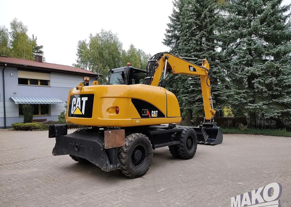 Caterpillar M313D - Pyöräalustainen kaivinkone: kuva Caterpillar M313D - Pyöräalustainen kaivinkone Caterpillar M313D - Pyöräalustainen kaivinkone: kuva Caterpillar M313D - Pyöräalustainen kaivinkone