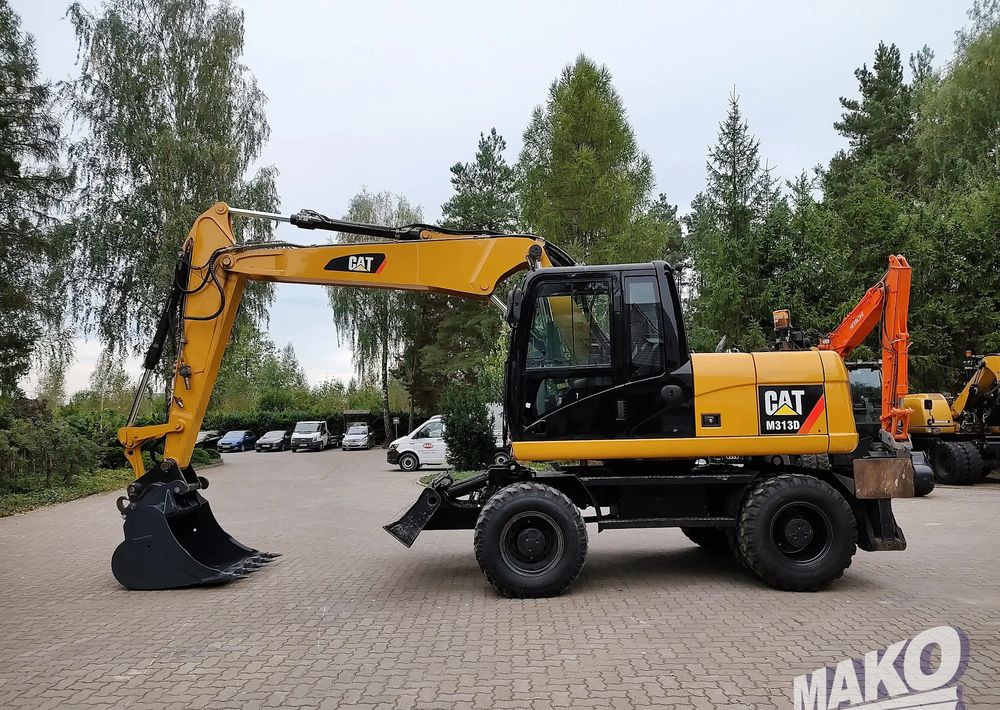 Caterpillar M313D - Pyöräalustainen kaivinkone: kuva Caterpillar M313D - Pyöräalustainen kaivinkone Caterpillar M313D - Pyöräalustainen kaivinkone: kuva Caterpillar M313D - Pyöräalustainen kaivinkone