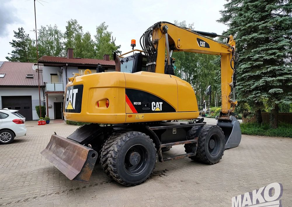 Caterpillar M313D - Pyöräalustainen kaivinkone: kuva Caterpillar M313D - Pyöräalustainen kaivinkone Caterpillar M313D - Pyöräalustainen kaivinkone: kuva Caterpillar M313D - Pyöräalustainen kaivinkone