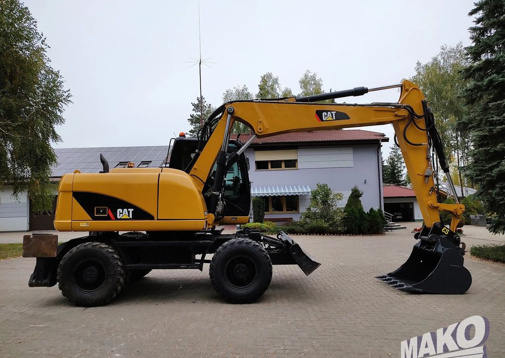 Caterpillar M313D - Pyöräalustainen kaivinkone: kuva  Caterpillar M313D - Pyöräalustainen kaivinkone Caterpillar M313D - Pyöräalustainen kaivinkone: kuva  Caterpillar M313D - Pyöräalustainen kaivinkone