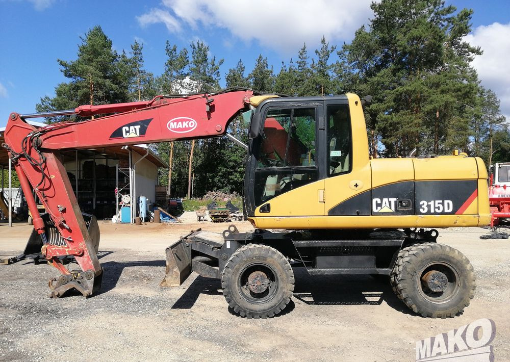 Caterpillar M315 C - Pyöräalustainen kaivinkone: kuva Caterpillar M315 C - Pyöräalustainen kaivinkone Caterpillar M315 C - Pyöräalustainen kaivinkone: kuva Caterpillar M315 C - Pyöräalustainen kaivinkone