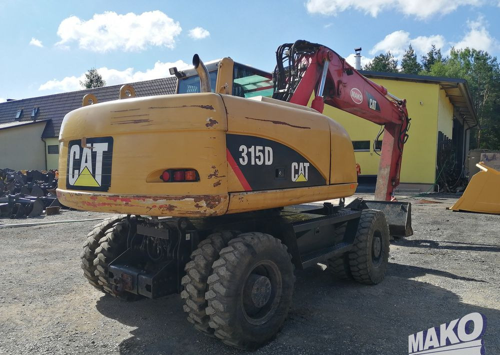 Caterpillar M315 C - Pyöräalustainen kaivinkone: kuva Caterpillar M315 C - Pyöräalustainen kaivinkone Caterpillar M315 C - Pyöräalustainen kaivinkone: kuva Caterpillar M315 C - Pyöräalustainen kaivinkone