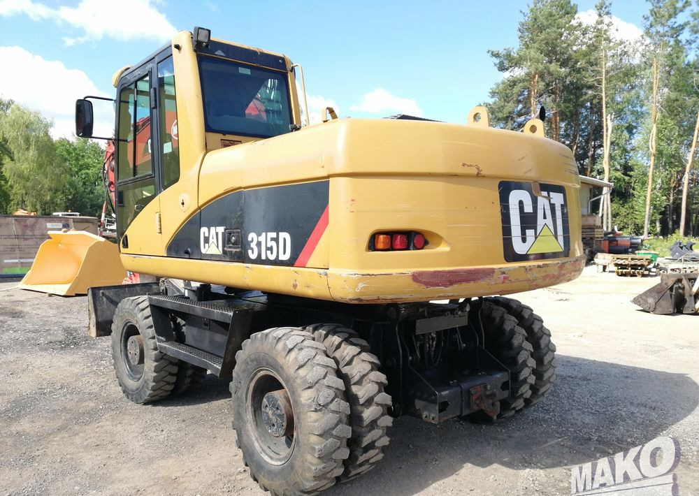 Caterpillar M315 C - Pyöräalustainen kaivinkone: kuva Caterpillar M315 C - Pyöräalustainen kaivinkone Caterpillar M315 C - Pyöräalustainen kaivinkone: kuva Caterpillar M315 C - Pyöräalustainen kaivinkone