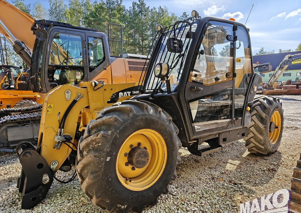 Caterpillar TH407 - Kurottaja: kuva Caterpillar TH407 - Kurottaja Caterpillar TH407 - Kurottaja: kuva Caterpillar TH407 - Kurottaja