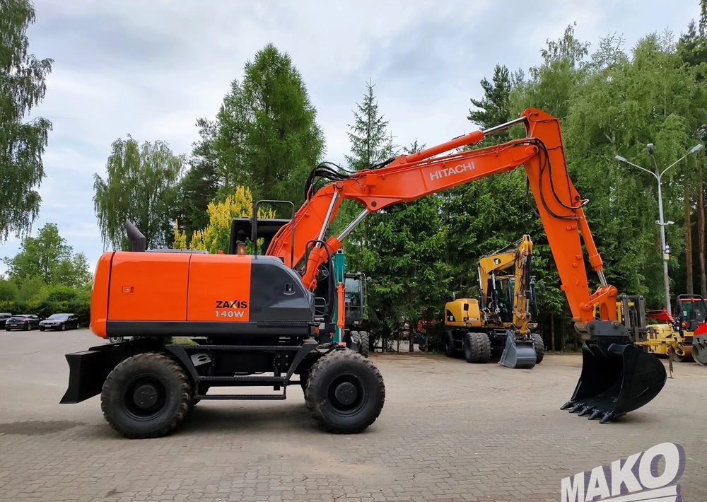 Hitachi ZX 140 - Pyöräalustainen kaivinkone: kuva Hitachi ZX 140 - Pyöräalustainen kaivinkone Hitachi ZX 140 - Pyöräalustainen kaivinkone: kuva Hitachi ZX 140 - Pyöräalustainen kaivinkone