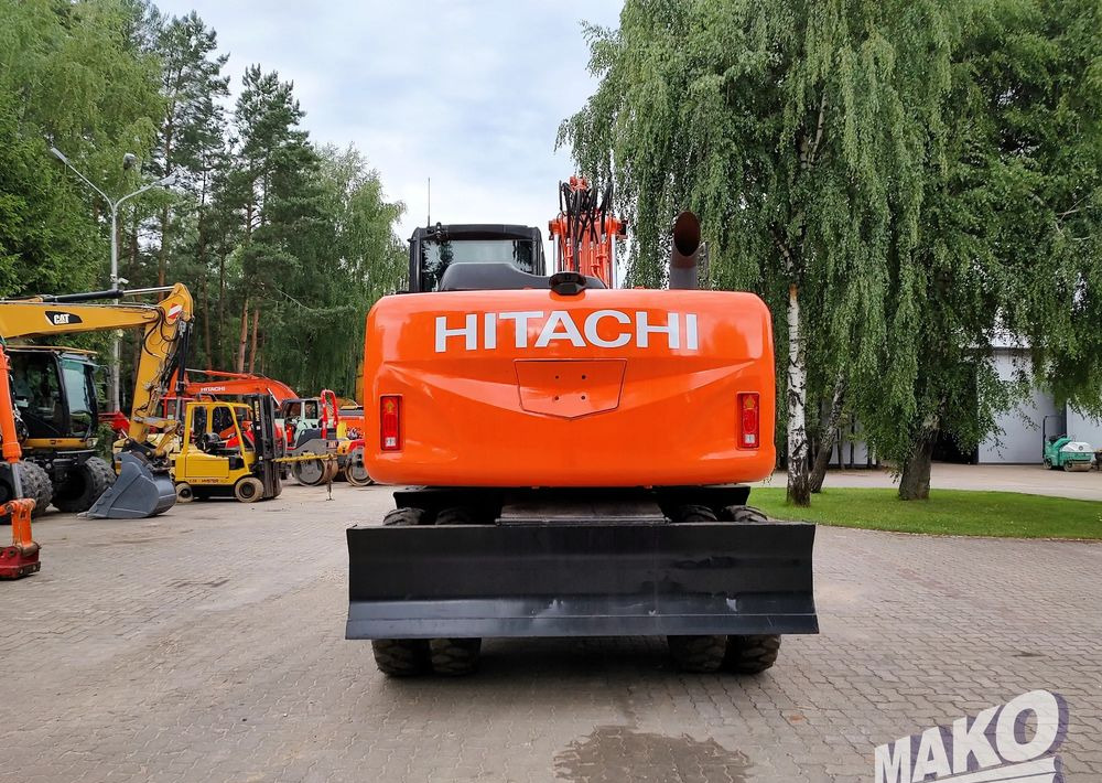 Hitachi ZX 140 - Pyöräalustainen kaivinkone: kuva Hitachi ZX 140 - Pyöräalustainen kaivinkone Hitachi ZX 140 - Pyöräalustainen kaivinkone: kuva Hitachi ZX 140 - Pyöräalustainen kaivinkone