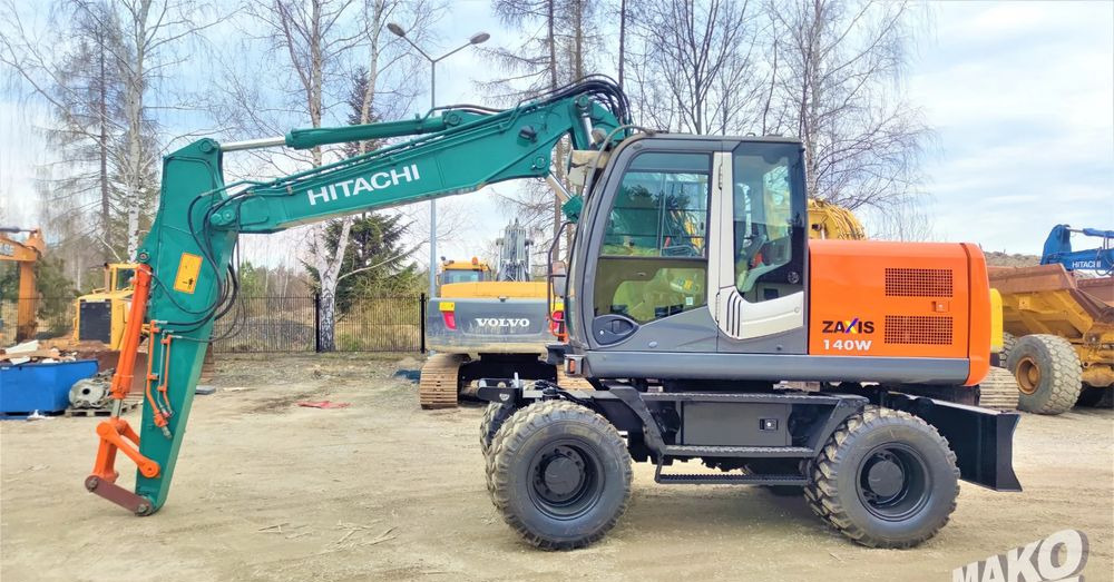 Hitachi ZX140W-3 - Pyöräalustainen kaivinkone: kuva Hitachi ZX140W-3 - Pyöräalustainen kaivinkone Hitachi ZX140W-3 - Pyöräalustainen kaivinkone: kuva Hitachi ZX140W-3 - Pyöräalustainen kaivinkone