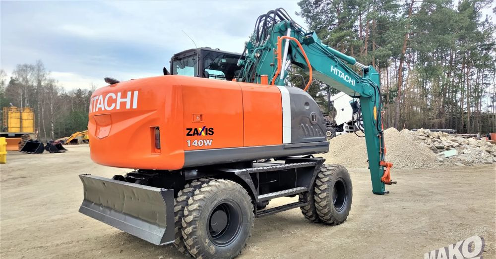 Hitachi ZX140W-3 - Pyöräalustainen kaivinkone: kuva Hitachi ZX140W-3 - Pyöräalustainen kaivinkone Hitachi ZX140W-3 - Pyöräalustainen kaivinkone: kuva Hitachi ZX140W-3 - Pyöräalustainen kaivinkone