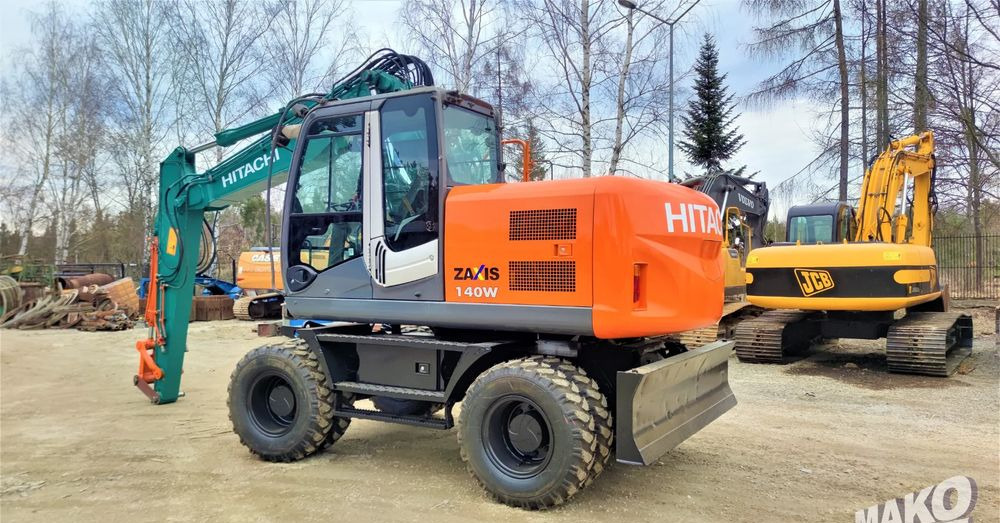 Hitachi ZX140W-3 - Pyöräalustainen kaivinkone: kuva Hitachi ZX140W-3 - Pyöräalustainen kaivinkone Hitachi ZX140W-3 - Pyöräalustainen kaivinkone: kuva Hitachi ZX140W-3 - Pyöräalustainen kaivinkone