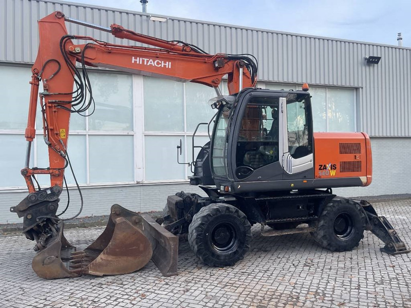 Hitachi ZX 140 W-3 - Pyöräalustainen kaivinkone: kuva Hitachi ZX 140 W-3 - Pyöräalustainen kaivinkone Hitachi ZX 140 W-3 - Pyöräalustainen kaivinkone: kuva Hitachi ZX 140 W-3 - Pyöräalustainen kaivinkone