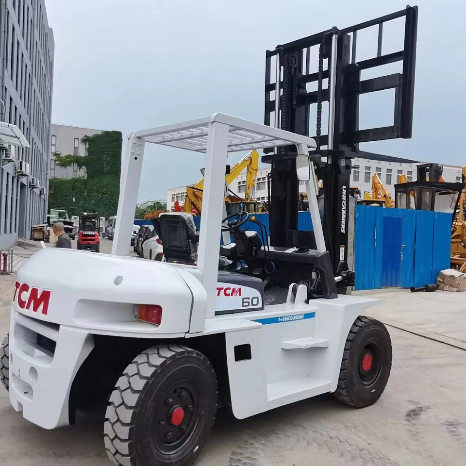 TCM 6 ton Diesel Forklift FD60 with Fork Positioner - Dieseltrukki: kuva TCM 6 ton Diesel Forklift FD60 with Fork Positioner - Dieseltrukki TCM 6 ton Diesel Forklift FD60 with Fork Positioner - Dieseltrukki: kuva TCM 6 ton Diesel Forklift FD60 with Fork Positioner - Dieseltrukki