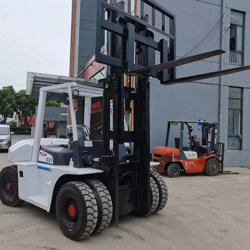 TCM 6 ton Diesel Forklift FD60 with Fork Positioner - Dieseltrukki: kuva TCM 6 ton Diesel Forklift FD60 with Fork Positioner - Dieseltrukki TCM 6 ton Diesel Forklift FD60 with Fork Positioner - Dieseltrukki: kuva TCM 6 ton Diesel Forklift FD60 with Fork Positioner - Dieseltrukki