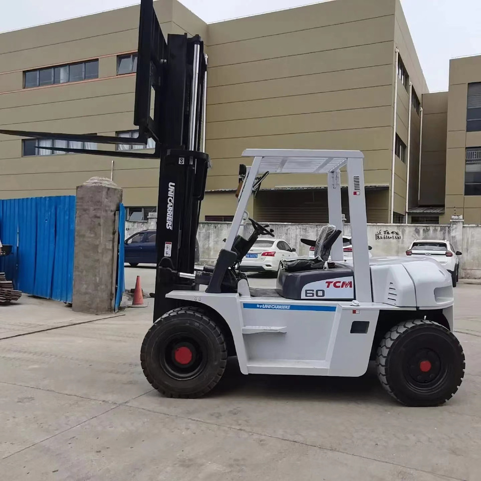 TCM 6 ton Diesel Forklift FD60 with Fork Positioner - Dieseltrukki: kuva TCM 6 ton Diesel Forklift FD60 with Fork Positioner - Dieseltrukki TCM 6 ton Diesel Forklift FD60 with Fork Positioner - Dieseltrukki: kuva TCM 6 ton Diesel Forklift FD60 with Fork Positioner - Dieseltrukki